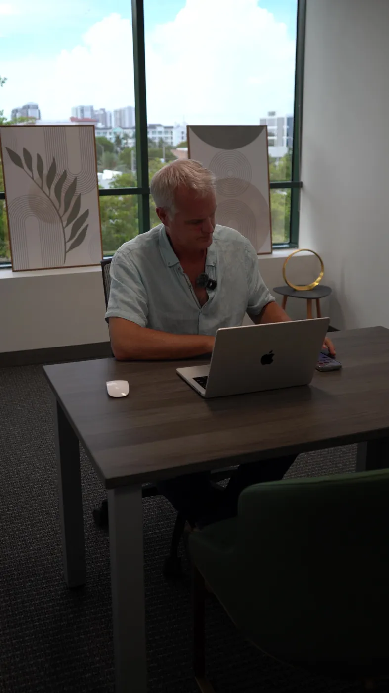 Working on client accounts at the Optic Vault office in Miami